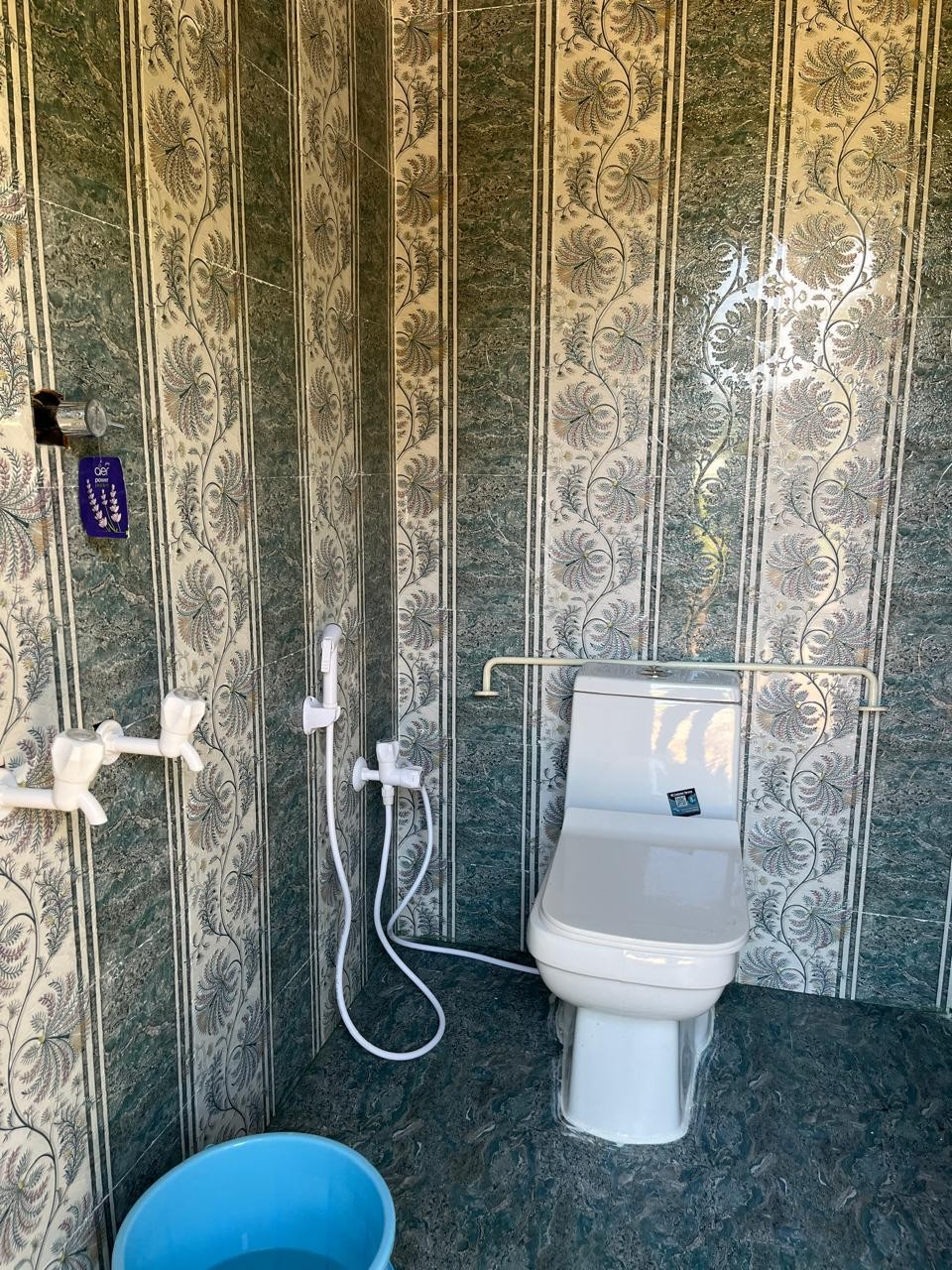 Kerala villa attached bathroom with green marble