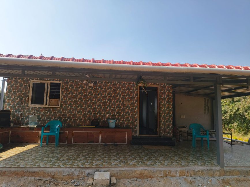Kerala Villa exterior — tiled roof, porch, open verandah
